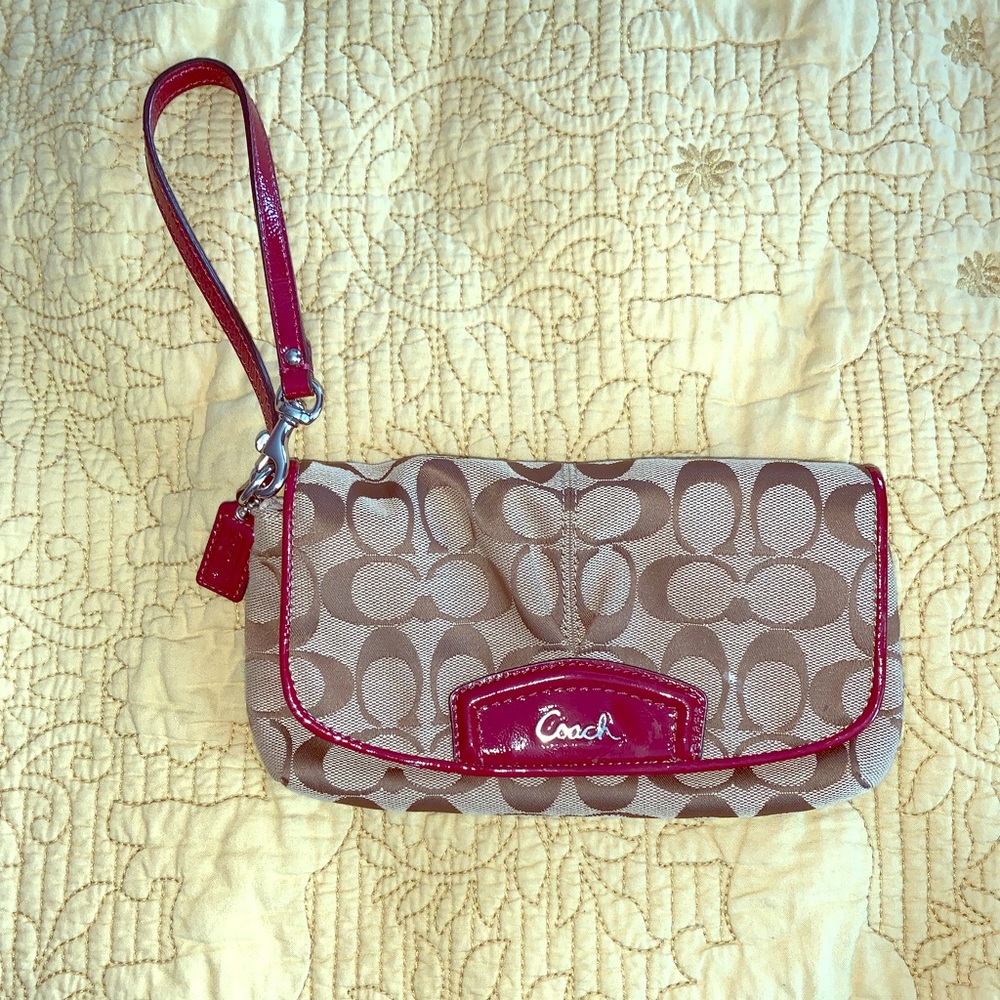 Coach signature wristlet with maroon patron accent